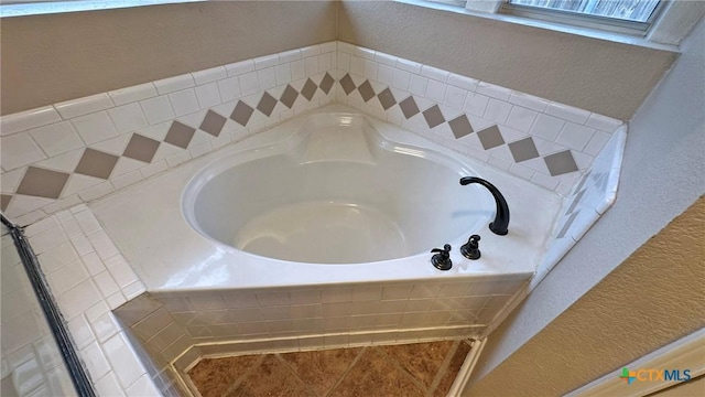 601 Barber Dr, Copperas Cove, TX 76522 - full bathroom with a textured wall, a garden tub, and tile patterned floors