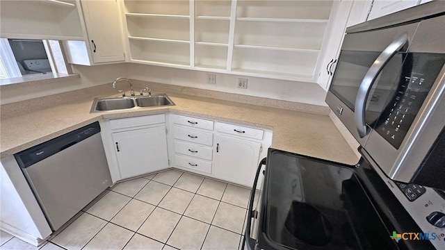 601 Barber Dr, Copperas Cove, TX 76522 - kitchen featuring open shelves, stainless steel appliances, a sink, and white cabinets