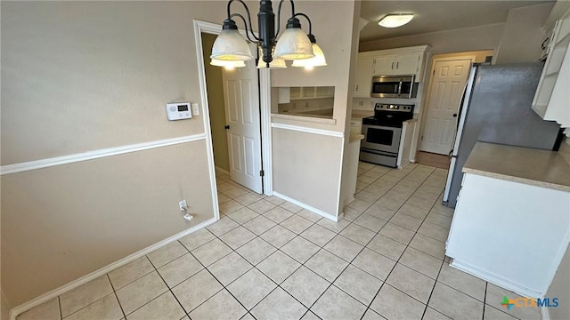 601 Barber Dr, Copperas Cove, TX 76522 - kitchen with stainless steel appliances, white cabinets, light countertops, and light tile patterned flooring