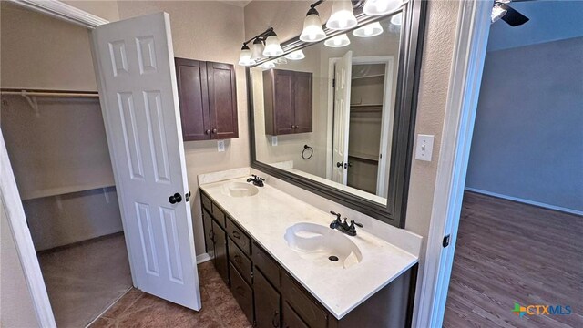 601 Barber Dr, Copperas Cove, TX 76522 - full bathroom with a walk in closet, a chandelier, double vanity, and baseboards