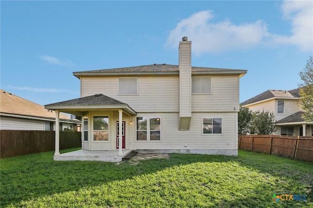 back of property with a patio area and a chimney
