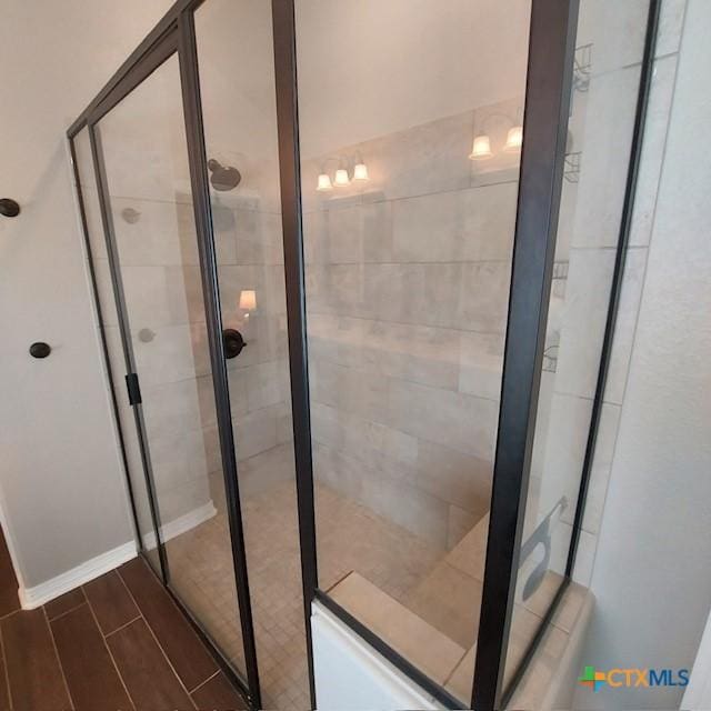 1802 Rustic Manor Dr, Temple, TX 76502 - bathroom featuring a shower stall, wood finished floors, and baseboards