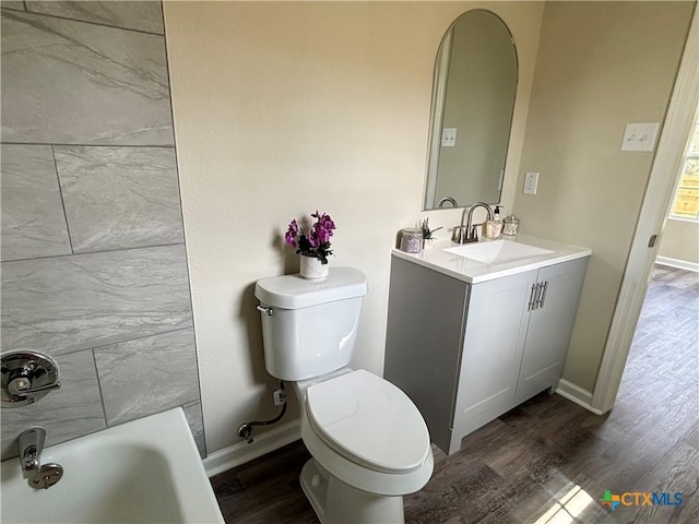 708 E 5th St, Nixon, TX 78140 - full bath with wood finished floors and vanity