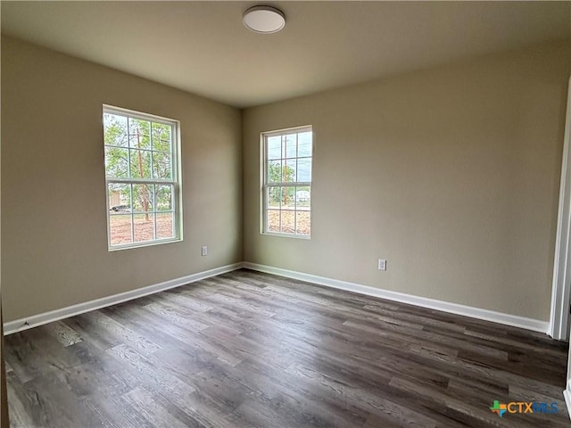 708 E 5th St, Nixon, TX 78140 - unfurnished room featuring plenty of natural light and dark wood-style flooring