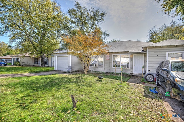 ranch-style house with a front lawn and a garage