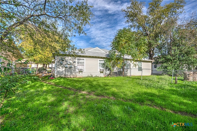 back of house featuring a yard