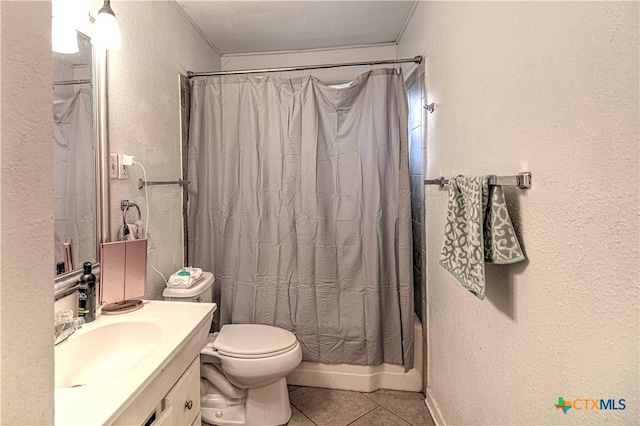 full bathroom with toilet, vanity, shower / bath combination with curtain, and tile patterned flooring