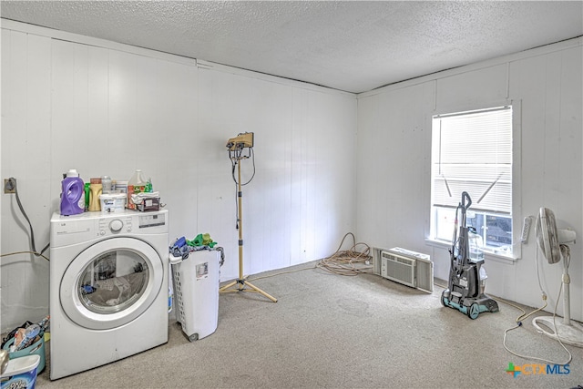 washroom featuring washer / clothes dryer, carpet, a textured ceiling, and wood walls