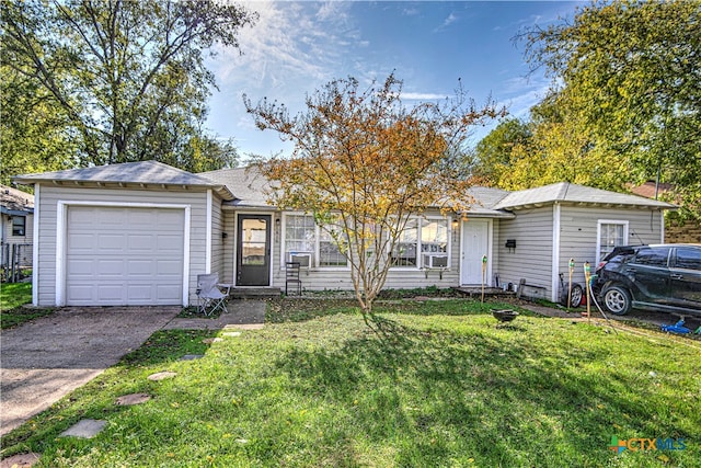 ranch-style house featuring a garage, cooling unit, and a front lawn