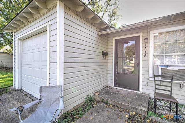 doorway to property featuring a garage