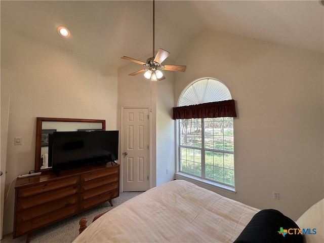 carpeted bedroom featuring high vaulted ceiling, multiple windows, and ceiling fan