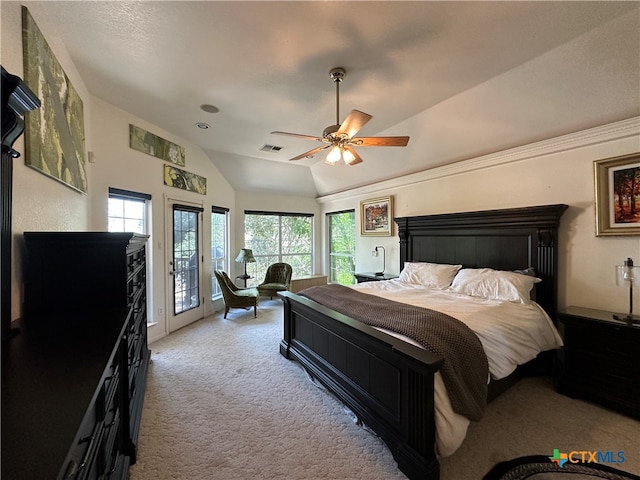 carpeted bedroom with access to outside, multiple windows, ceiling fan, and vaulted ceiling