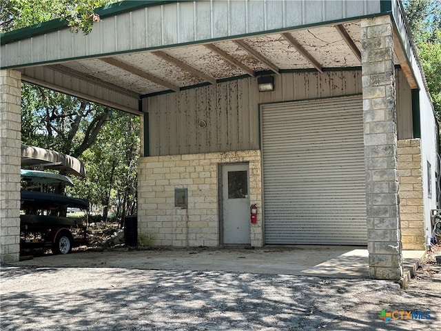 garage featuring a carport