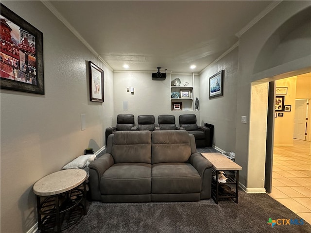 tiled home theater room featuring ornamental molding