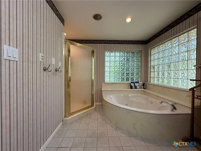 bathroom with tile patterned floors and separate shower and tub