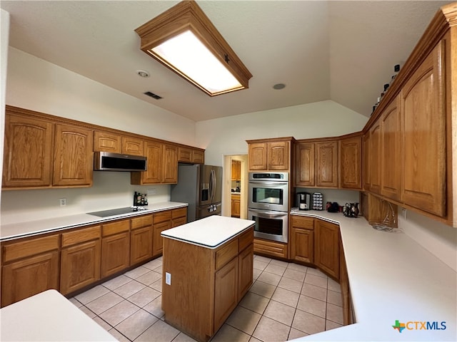 kitchen with stainless steel appliances, a center island, vaulted ceiling, light tile patterned floors, and ventilation hood