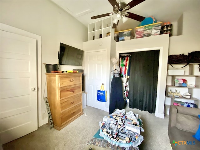 carpeted bedroom featuring vaulted ceiling and ceiling fan