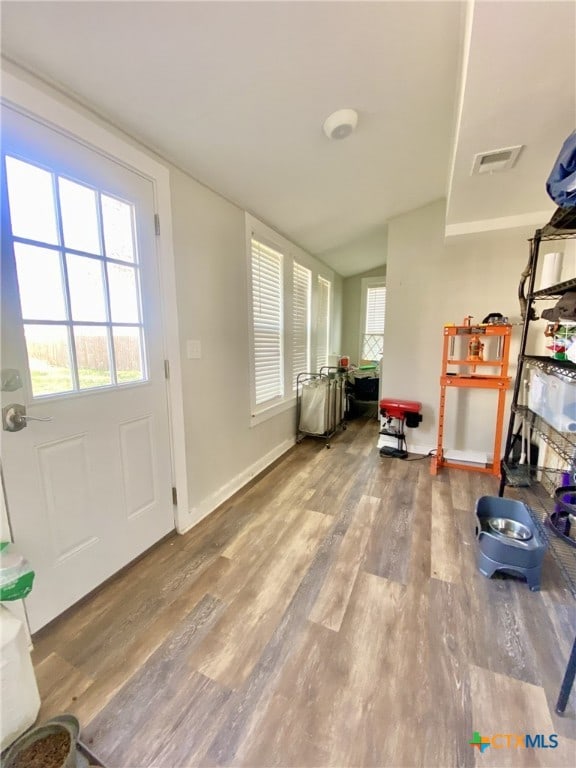 doorway to outside with hardwood / wood-style floors