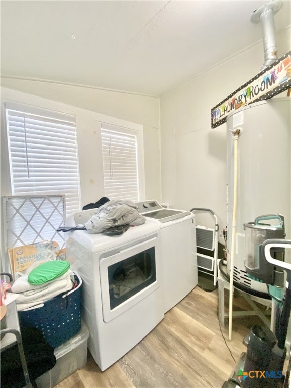 washroom featuring light hardwood / wood-style flooring and washing machine and dryer