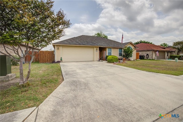 ranch-style house with concrete driveway, an attached garage, fence, a front yard, and stucco siding
