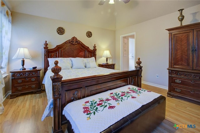 bedroom featuring light wood-type flooring, baseboards, and ceiling fan