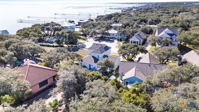 birds eye view of property featuring a water view and a residential view