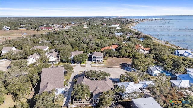 drone / aerial view featuring a water view and a residential view