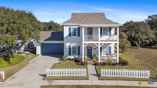 view of front of house with driveway, a balcony, roof with shingles, an attached garage, and covered porch