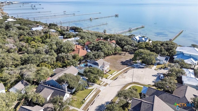 drone / aerial view featuring a water view and a residential view