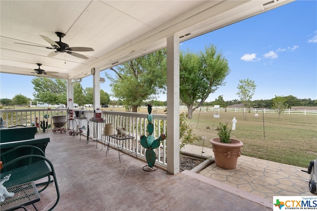 view of patio / terrace with a rural view and ceiling fan