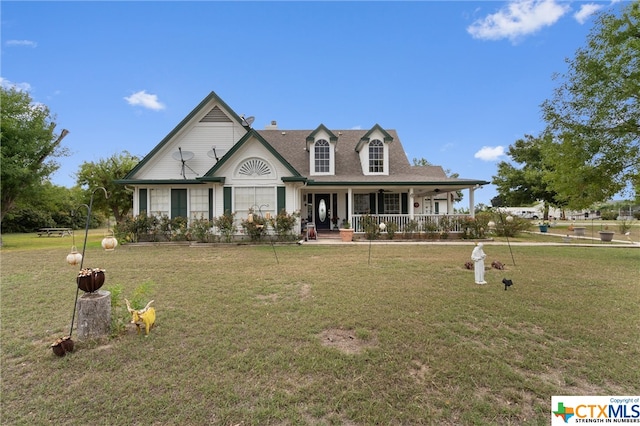 view of front of home with covered porch and a front yard