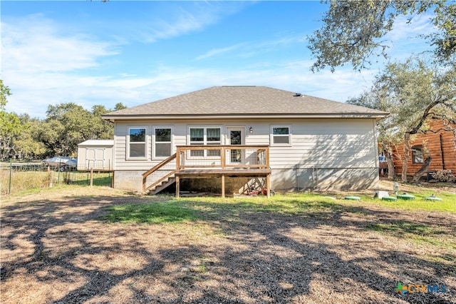 back of house featuring a deck