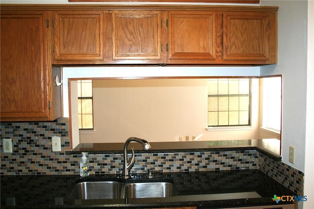 kitchen with decorative backsplash and sink