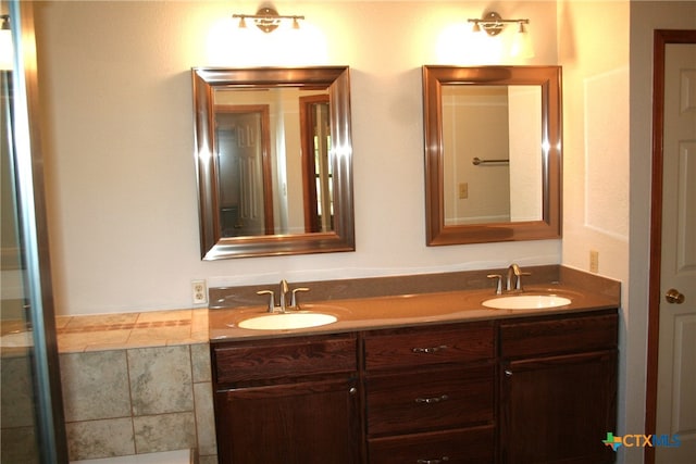 kitchen featuring tile patterned flooring, appliances with stainless steel finishes, backsplash, and sink