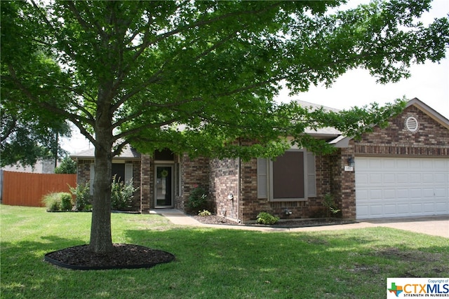 view of front facade featuring a garage and a front yard