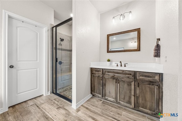 3424 Waggoner Dr, Belton, TX 76513 - full bath featuring a stall shower, vanity, and wood finished floors