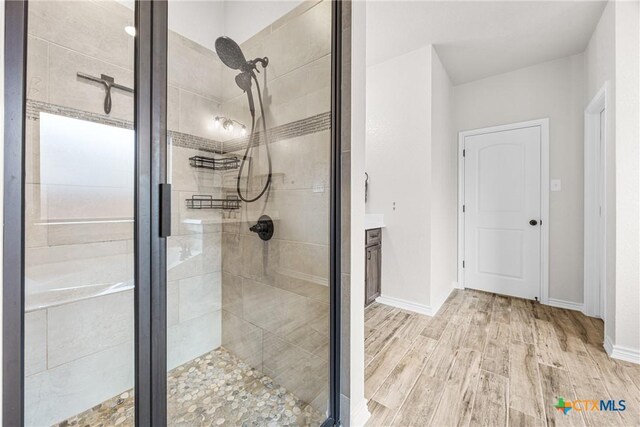 3424 Waggoner Dr, Belton, TX 76513 - full bath featuring wood finished floors, a shower stall, and vanity