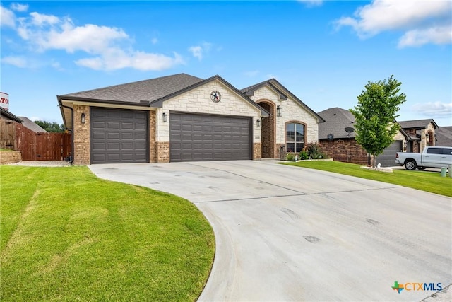 3424 Waggoner Dr, Belton, TX 76513 - french provincial home featuring an attached garage, driveway, brick siding, and a shingled roof