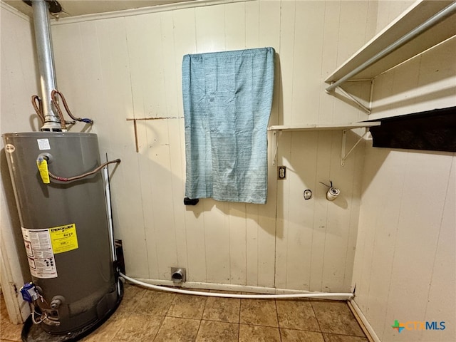 utility room featuring gas water heater