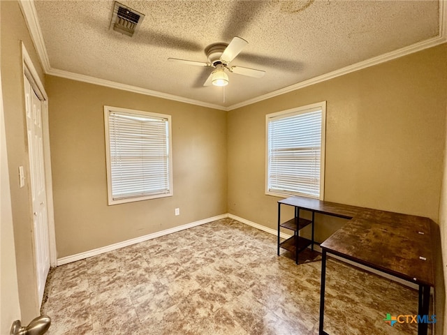 unfurnished office featuring a ceiling fan, baseboards, visible vents, and crown molding