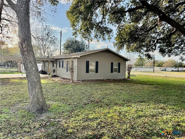 view of property exterior with a lawn