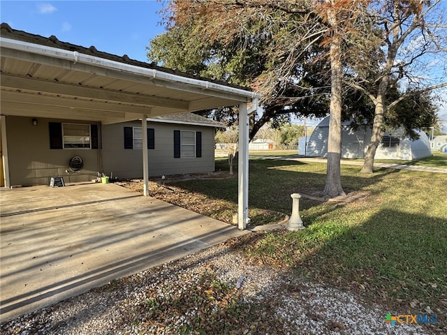 view of yard with an attached carport