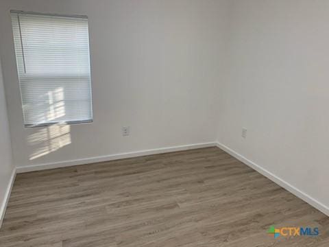 empty room featuring hardwood / wood-style floors