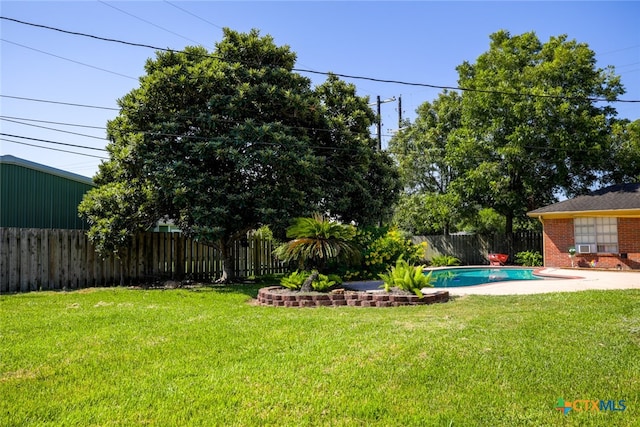 view of yard with a fenced in pool