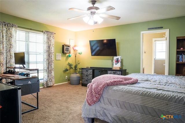 bedroom with multiple windows, carpet, and ceiling fan