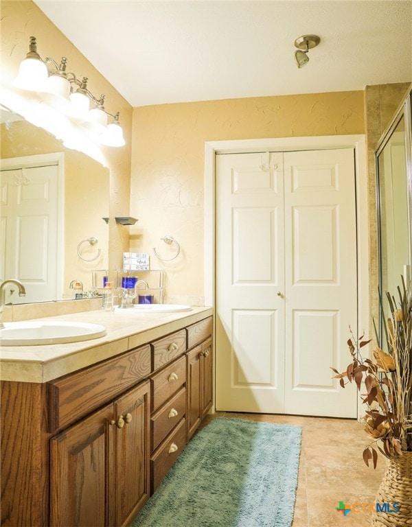 bathroom with an enclosed shower and vanity