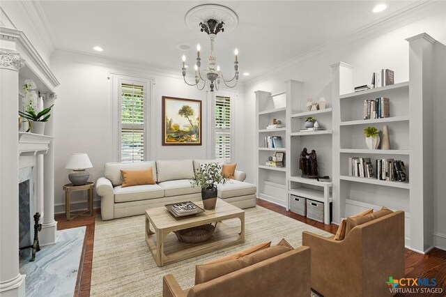 6 Carriage Sq, Waco, TX 76708 - living area with a notable chandelier, a high end fireplace, crown molding, and wood finished floors
