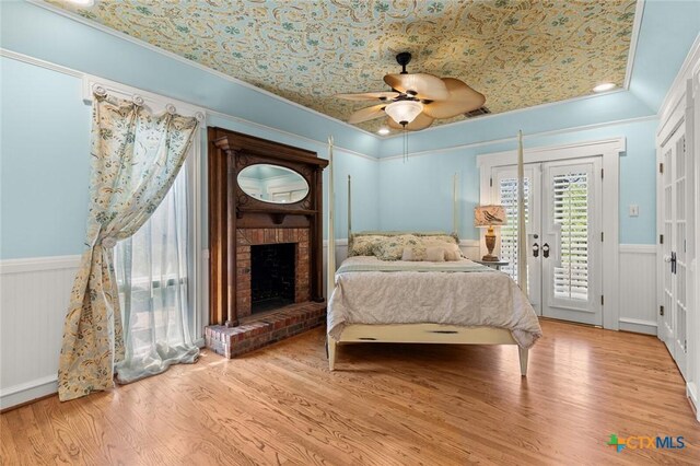 6 Carriage Sq, Waco, TX 76708 - bedroom featuring wainscoting, ornamental molding, wood finished floors, and access to exterior