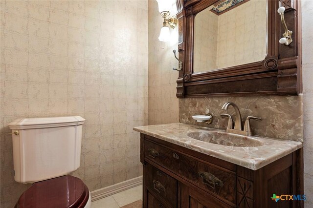 6 Carriage Sq, Waco, TX 76708 - half bath with backsplash, toilet, vanity, and tile patterned floors