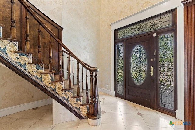 6 Carriage Sq, Waco, TX 76708 - tiled entryway featuring stairway, baseboards, wallpapered walls, and a high ceiling